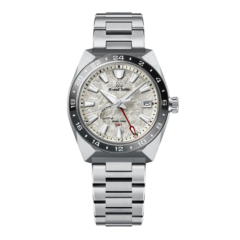 The Grand Seiko Spring Drive GMT Sport boasts a silver textured dial, high-intensity titanium bracelet, red GMT hand, and is powered by the precise 9R66 Spring Drive Caliber.