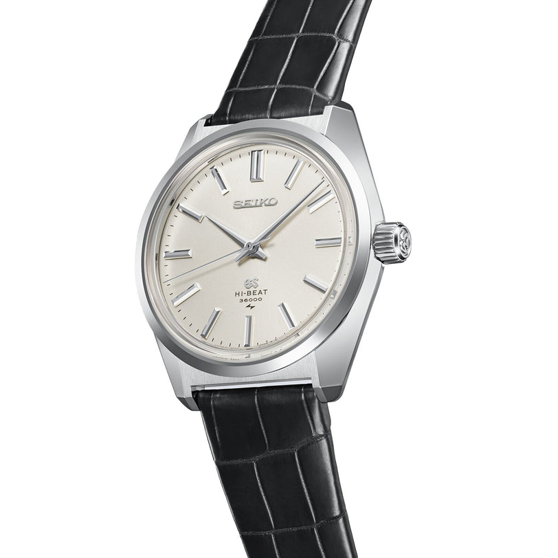 The Grand Seiko Manual Hi-Beat Heritage is a silver wristwatch featuring a white dial, silver hour markers and hands, a black leather strap, Hi-Beat 36000 above 6 oclock, and draws inspiration from the iconic 45GS high-beat movement.