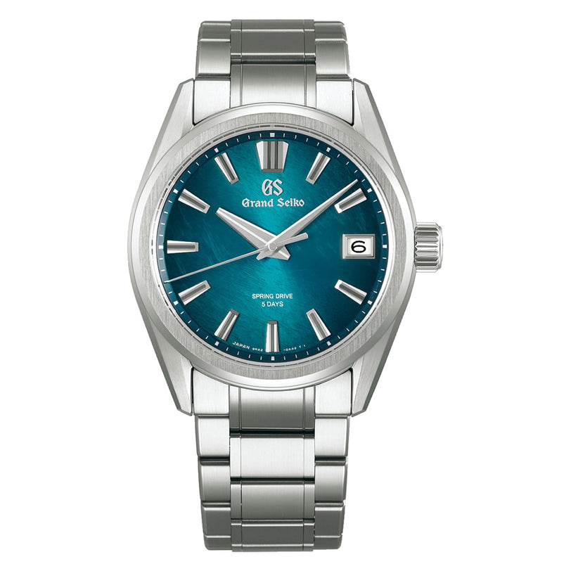 The Grand Seiko Spring Drive 5 Days Evolution 9 features a teal dial, silver markers and hands, a date window at 3 o’clock, metal link bracelet, and is powered by the precise Spring Drive Caliber 9RA2.