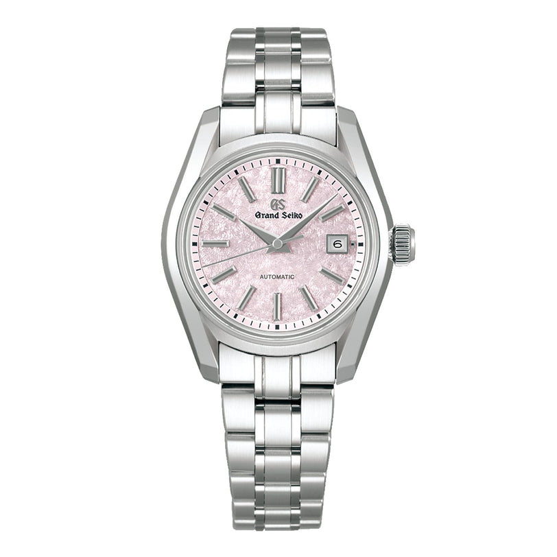 The Grand Seiko Ladies Automatic Heritage features a stainless steel case, metal link bracelet, pink cherry blossom-inspired textured dial, silver markers, date display, and automatic mechanical movement.