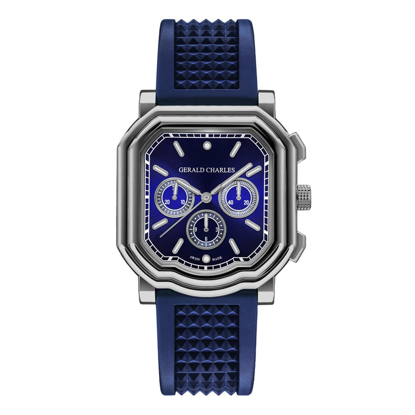 The Gerald Charles Maestro 3.0 Chronograph features a blue dial with Super-LumiNova markers, three subdials, silver accents, a geometric-patterned strap, and a silver case, displayed against a white background.