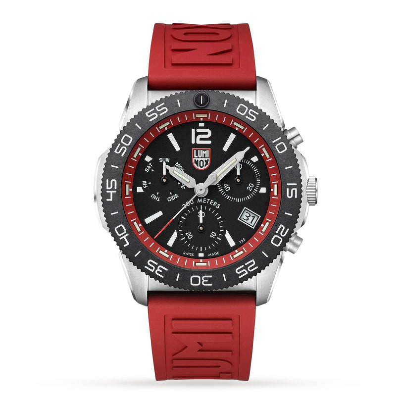 The Luminox Pacific Diver Chronograph Diver is a sporty wristwatch with a red band, black dial, silver casing, three subdials, and a date display.