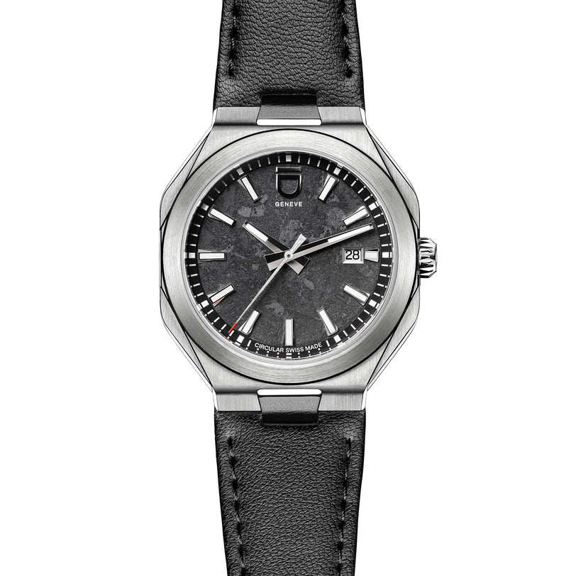 The ID Geneve Circular 1 - Mineral Black is a stainless steel watch featuring a black textured dial, date display, and black leather strap.