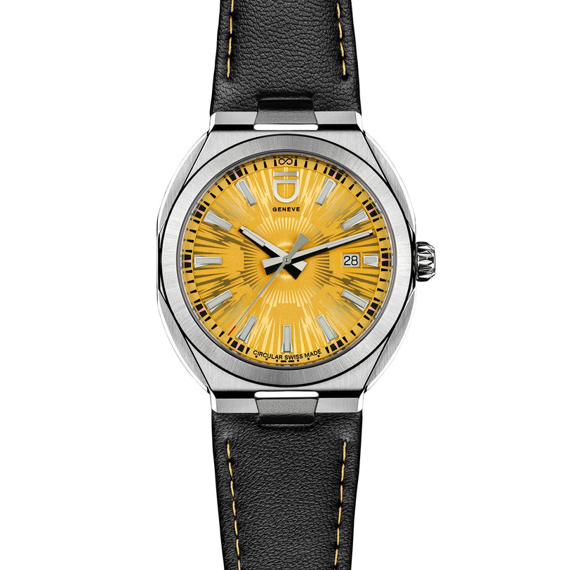 The Circular S - Sun Brushed by ID Geneve is a luxury wristwatch featuring a yellow dial, silver markers, and a black leather strap.