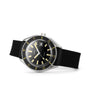 The DOXA Sub 200 Sharkhunter is a divers watch with a black dial, yellow markers, date display, unidirectional bezel, and a black textured strap, pictured on a white background.