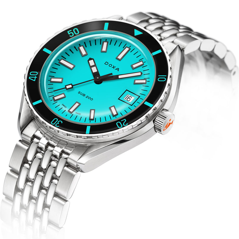 The DOXA Sub 200 Aquamarine is a divers watch with a turquoise dial, black unidirectional rotating bezel, date display at 3 o’clock, and is crafted from durable 316L stainless steel.