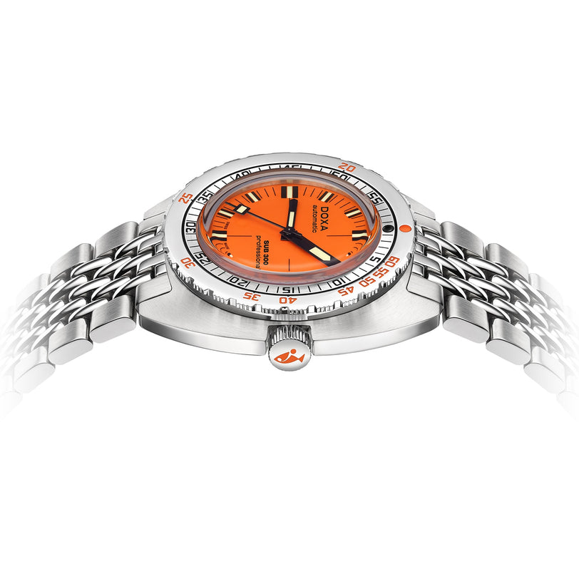 The DOXA Sub 300 Professional, a stainless steel divers watch with an orange dial, unidirectional silver bezel, and metal bracelet, is shown from a side angle against a white background.