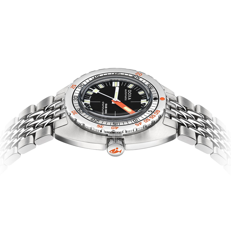The DOXA Sub 300 Sharkhunter is a stainless steel diver’s watch featuring a black dial, unidirectional bezel, silver and orange accents, and a metal bracelet band, shown from an angled side view.