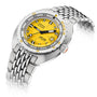 The DOXA Sub 300 Divingstar is a stainless steel diver’s watch with a yellow dial, unidirectional bezel, black and orange hands, date at 3 o’clock, and a linked metal bracelet.
