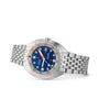 The DOXA Sub 300T Caribbean is a stainless steel divers watch with a blue dial, orange accents, date window, and metal link bracelet.