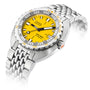 The DOXA Sub 300T Divingstar is a stainless steel diver’s watch with a yellow dial, black and orange accents, metal bracelet, and a helium release valve. The face reads “DOXA automatic Sub 300T Divingstar.”.
