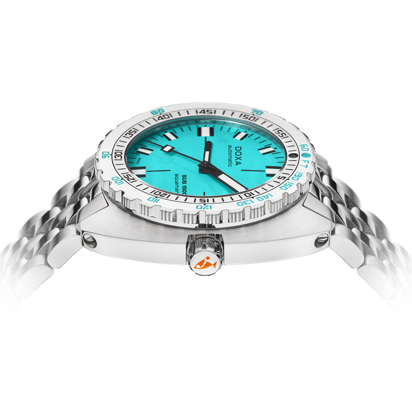 The DOXA Sub 1500T Aquamarine, a stainless steel diver’s watch with an aquamarine dial, silver bezel, and metal bracelet, features Super-LumiNova® luminescence—shown elegantly from the side.