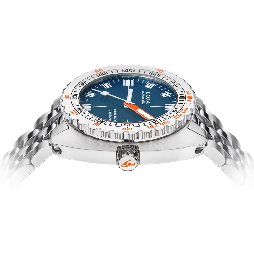 The DOXA Sub 1500T Caribbean is a stainless steel divers watch with a blue face, orange accents, and a metal bracelet, displayed from the side on a white background.