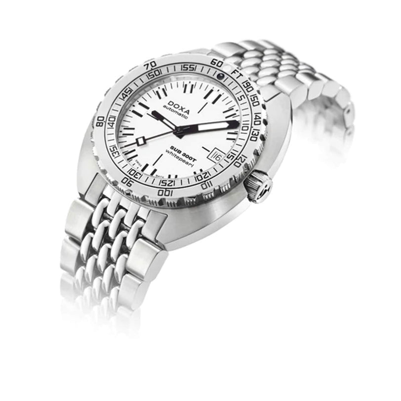 The DOXA Sub 300T Whitepearl, a silver divers watch with metal bracelet, white dial, black markers, rotating bezel, and helium release valve, is displayed at an angle on a white background.