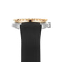 Side view of the DOXA Army Bronze wristwatch by DOXA, featuring a black rubber strap, stainless steel case, and bronze-tone ridged bezel against a white background.