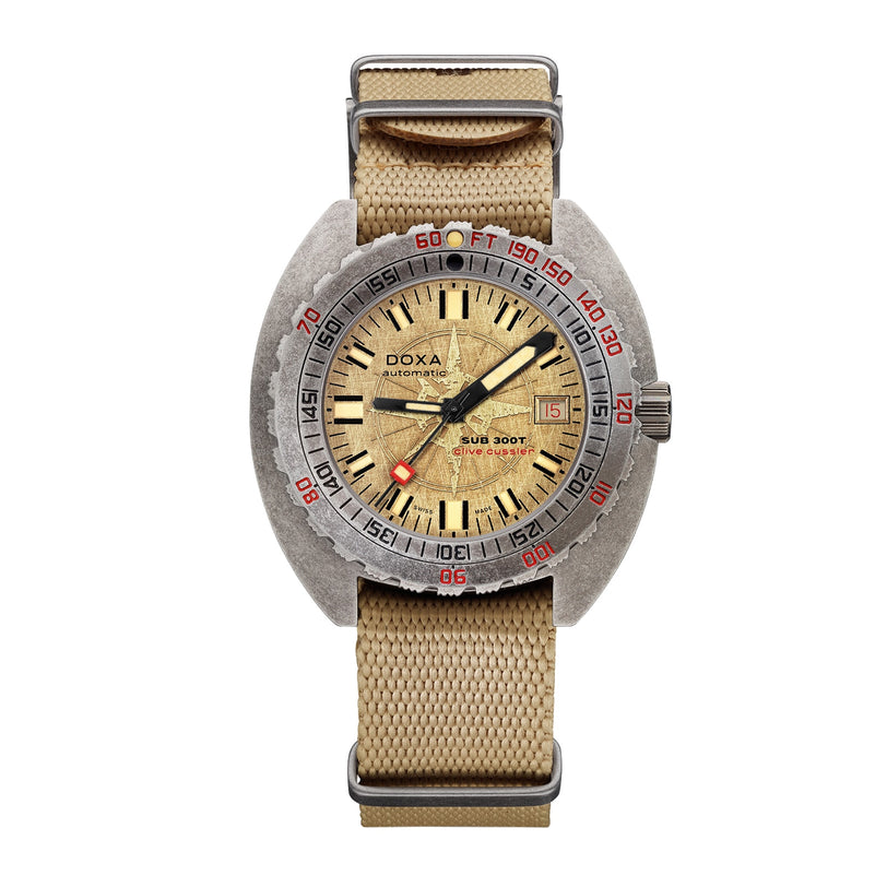 The DOXA Sub 300T Clive Cussler is a vintage-inspired dive watch with Swiss automatic movement, beige strap, yellowed dial, silver case, black and red bezel accents, date at 3 o’clock, and water resistance up to 1200 meters.
