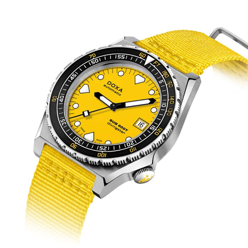 The DOXA Sub 600T Divingstar features a yellow dial, matching yellow fabric strap, black rotating bezel, and sleek 316L stainless steel case, shown angled for display.