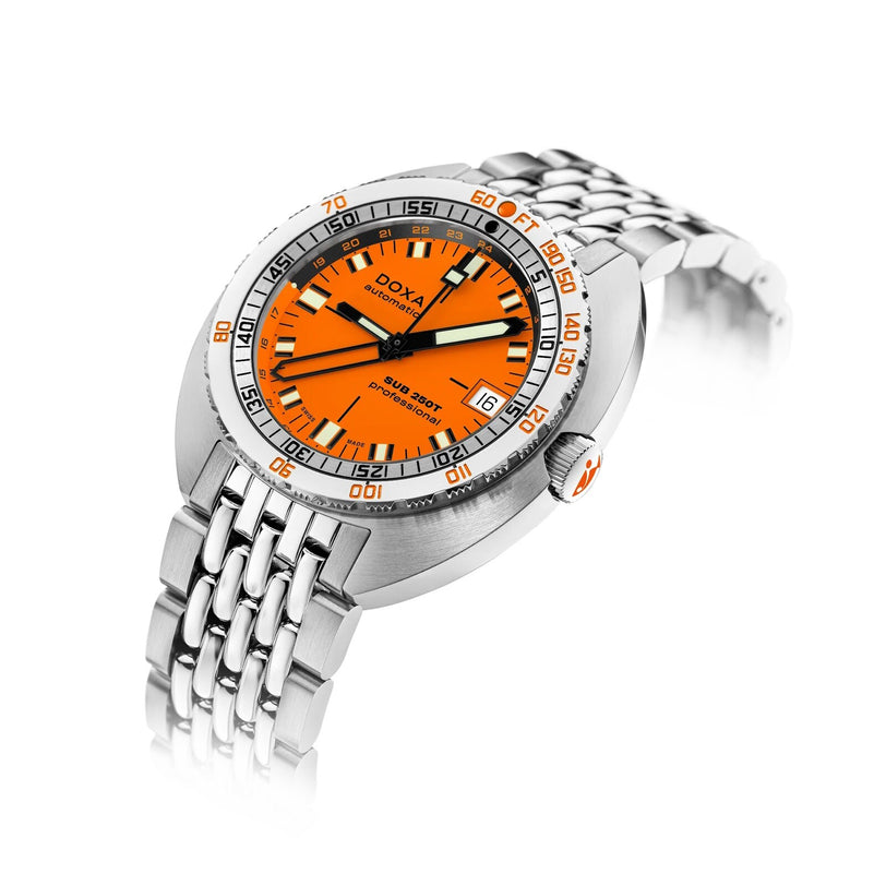 The DOXA SUB 250 GMT Professional is a silver dive watch with an orange dial and metal bracelet, shown angled on a white background.