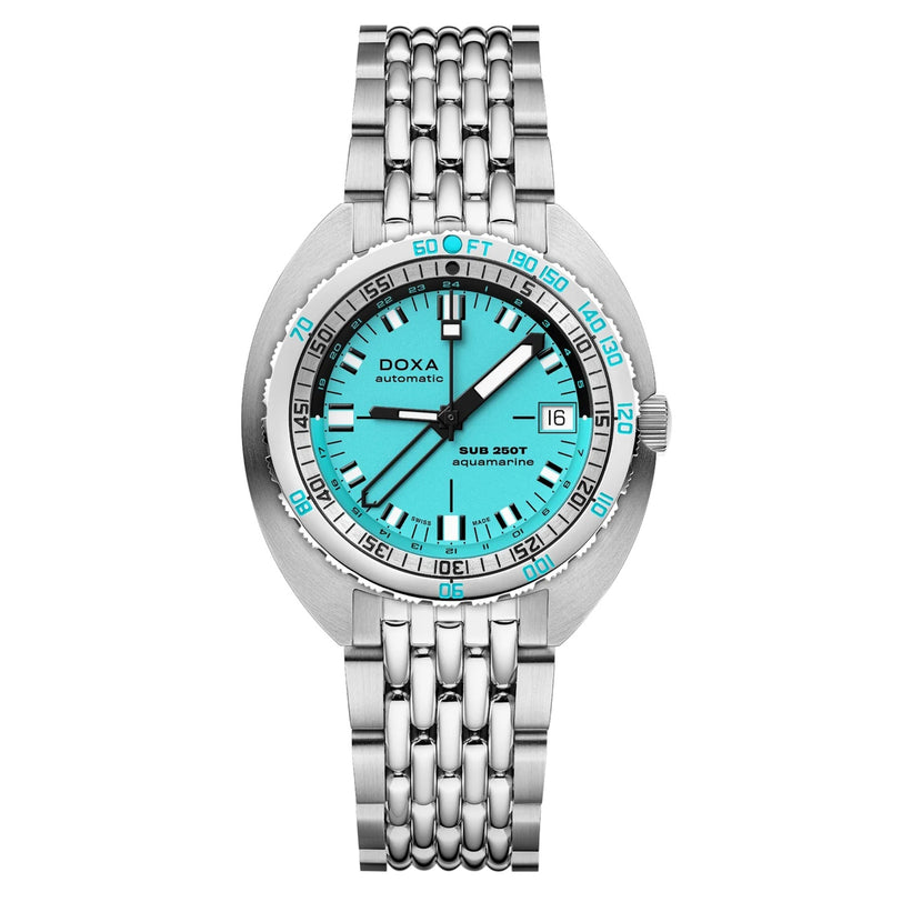 The DOXA SUB 250T GMT Aquamarine is a stainless steel dive watch with an aquamarine dial, black and white indices, a date window at 3 o’clock, and a silver link bracelet.