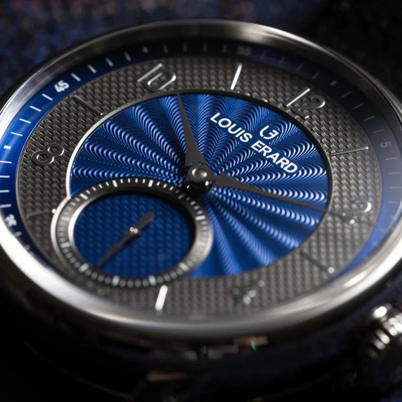 Close-up of the Louis Erard Petite Seconde Guilloché Anthracite Blue wristwatch, featuring a textured blue and silver dial with silver hour markers.