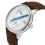 Le Régulateur Louis Erard x seconde/seconde/ by Louis Erard, featuring blue hands, a white dial, and brown suede strap, displayed at an angle on a white background.