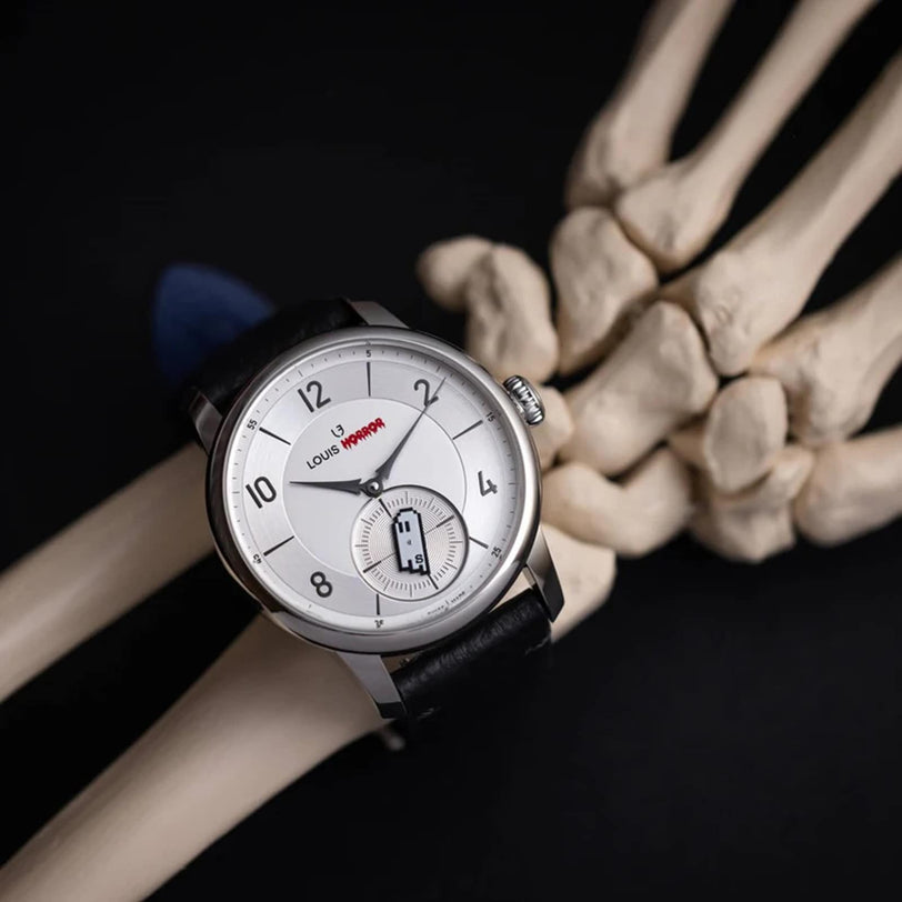The La Petite Seconde Louis Horror x seconde/seconde/ by Louis Erard is displayed on a skeleton hand against a black background.