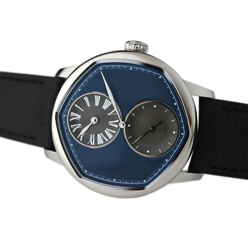The Louis Erard Le Régulateur Louis Erard x Cédric Johner Blue features an asymmetrical design with a blue face, Roman numerals, and two overlapping dials on a black strap.
