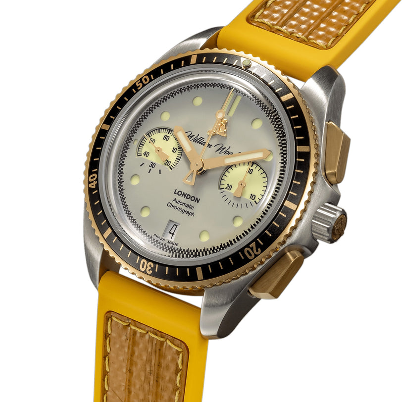 William Wood Triumph Collection - Fuel Edition wristwatch featuring a yellow strap, silver and gold case, black bezel, and two subdials shown from an angled view.