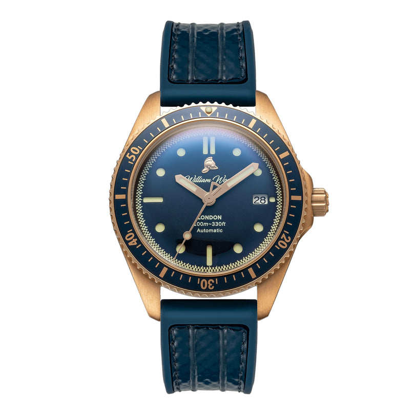The William Wood Valiant Collection - Bronze Sapphire wristwatch features a bronze case, blue bezel and strap, gold markers on a black dial, and displays 10:10.