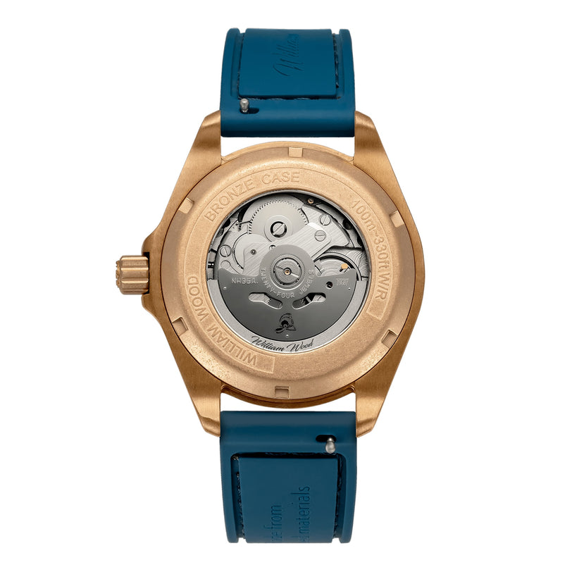 The back of the William Wood Valiant Collection - Bronze Sapphire wristwatch features a bronze case, visible mechanical movement, and a blue leather strap.