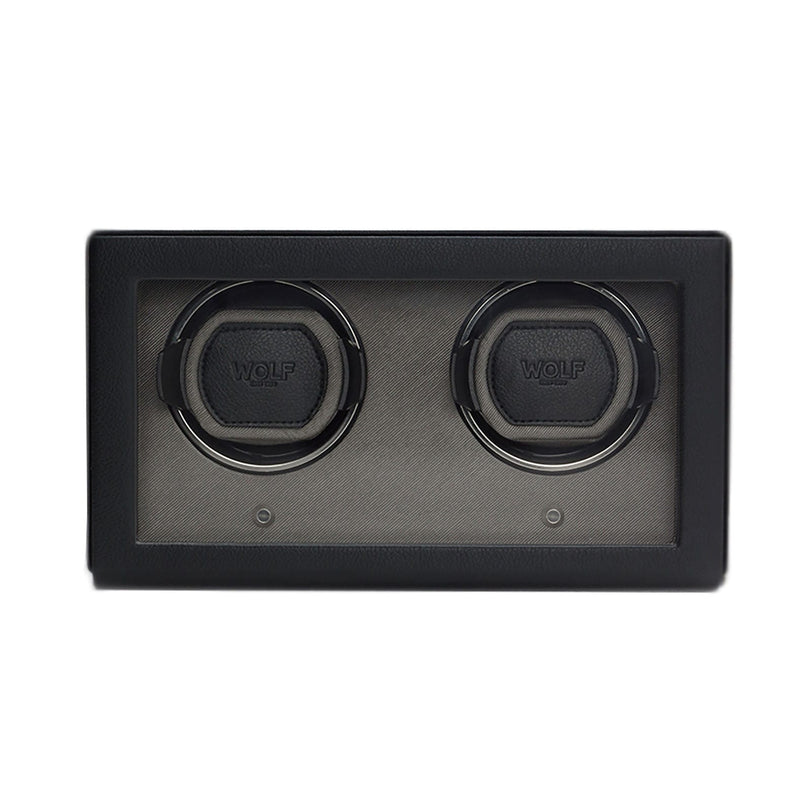The WOLF Cub Double Watch Winder with Cover is a black rectangular winder featuring a glass front that displays two watch slots.