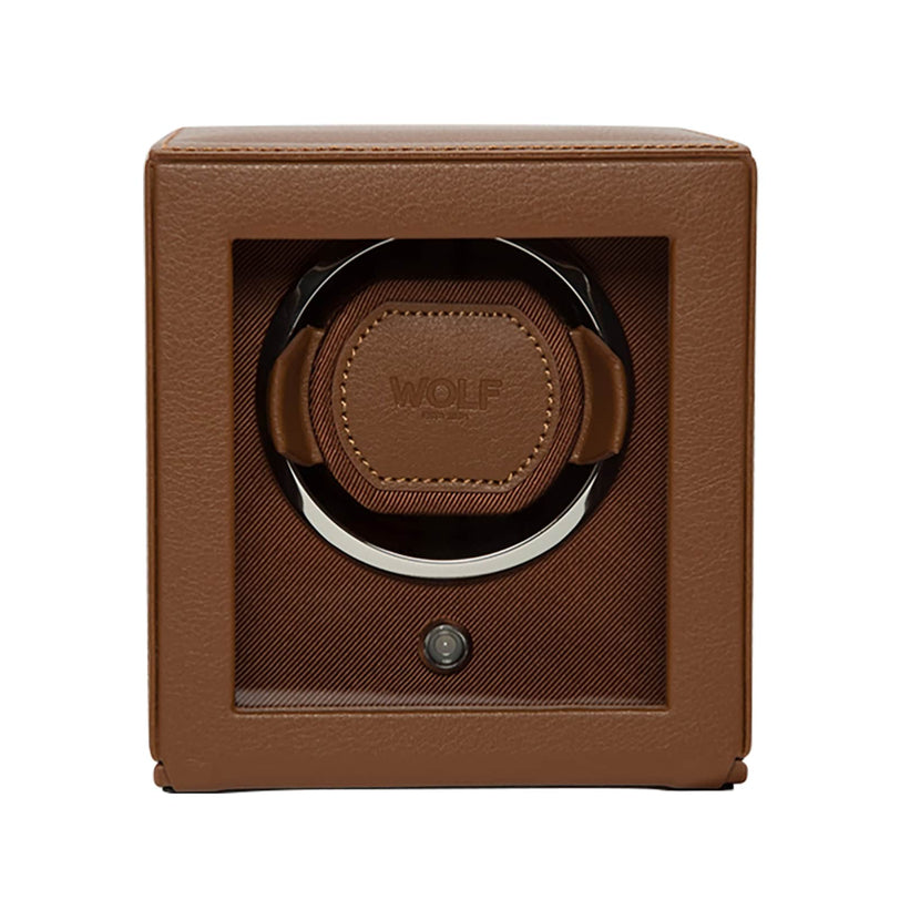 The WOLF Cub Single Watch Winder with Cover features a brown leather exterior, a clear front panel, and WOLF branding inside.