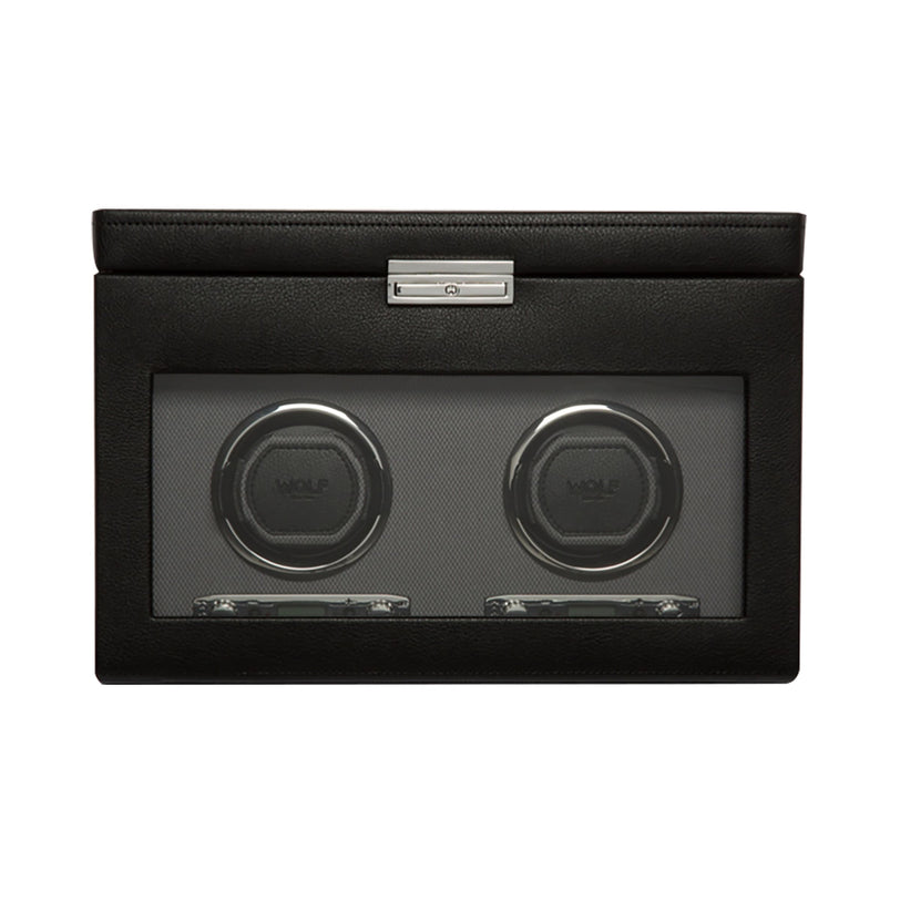 The WOLF Classic Single Watch Winder with Storage features a black leather exterior, a glass front, and space to wind one watch with additional storage inside.