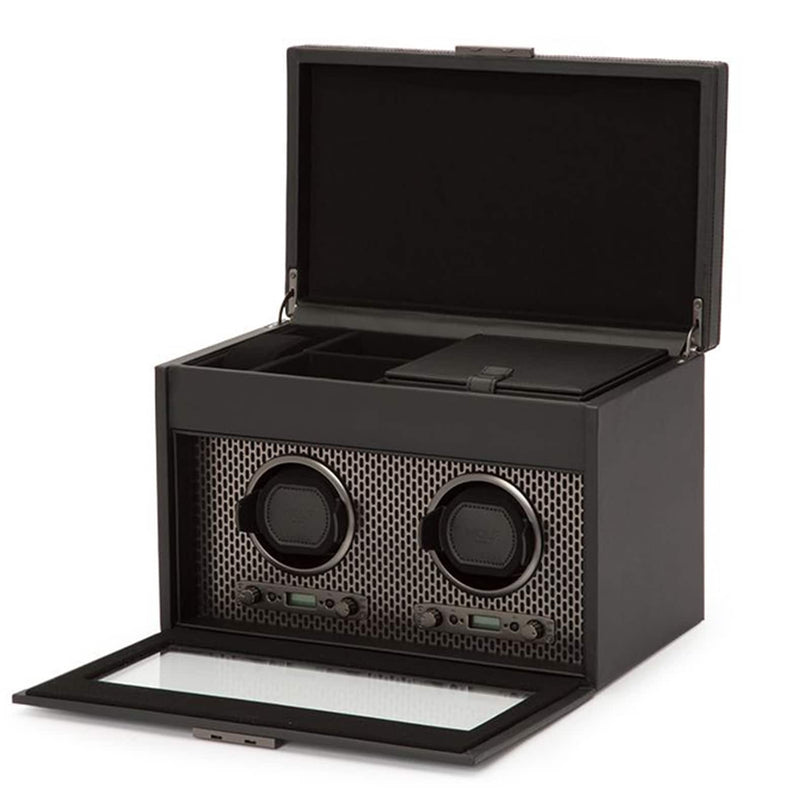 The WOLF Axis Double Watch Winder With Storage is a black box with two watch slots, an open lid, and top compartments.
