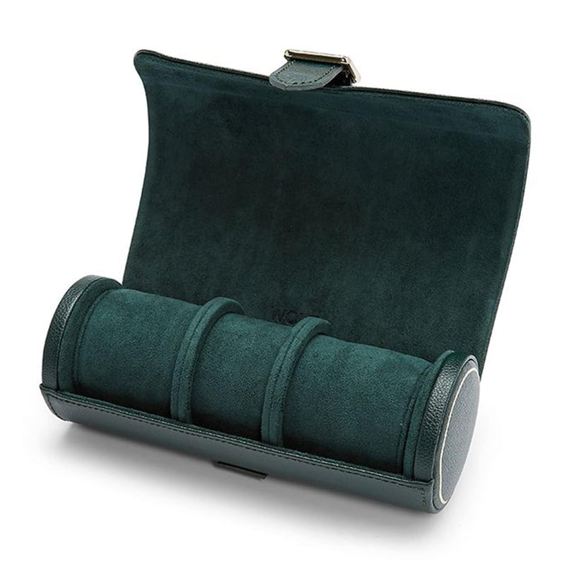 The WOLF British Racing Triple Watch Roll in dark green suede features three compartments, a soft interior, and a secure clasp when opened.