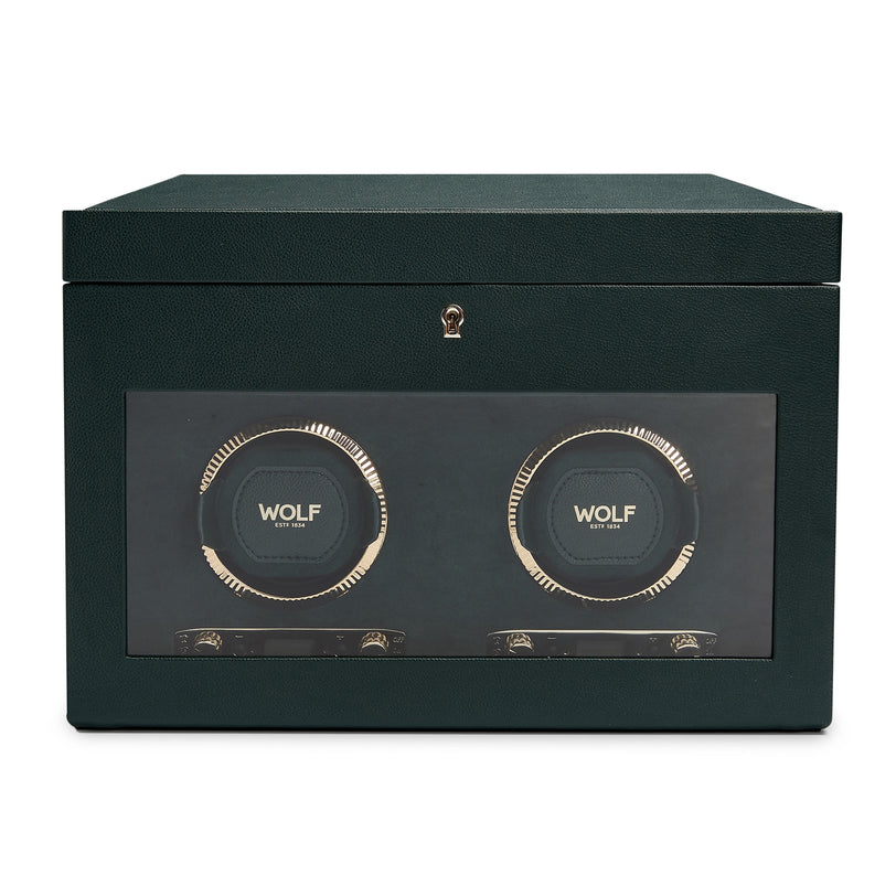 The WOLF British Racing Double Watch Winder with Storage is a dark green box with a glass front, showcasing space for two watches.