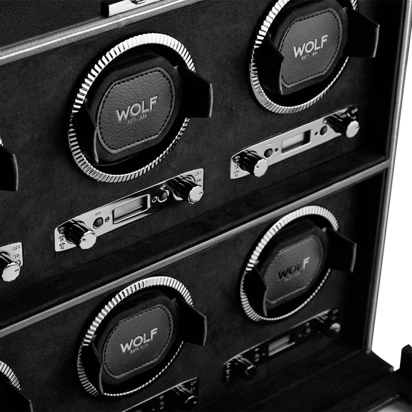 Close-up of a WOLF British Racing 6 Piece Watch Winder, featuring six winding modules with control dials in black and silver.