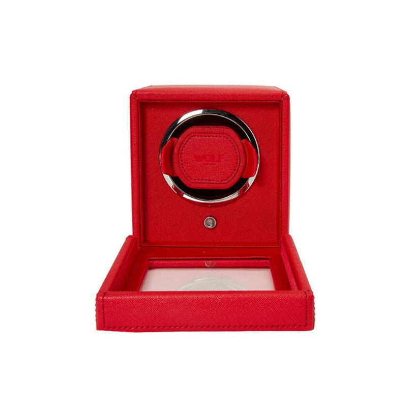 The WOLF Cub Single Watch Winder with Cover is shown in red with its lid open, revealing the holder inside.