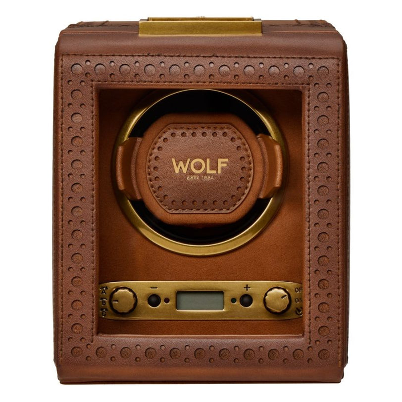 Brown leather watch winder with perforated brogue pattern, brass accents, and digital display controls.