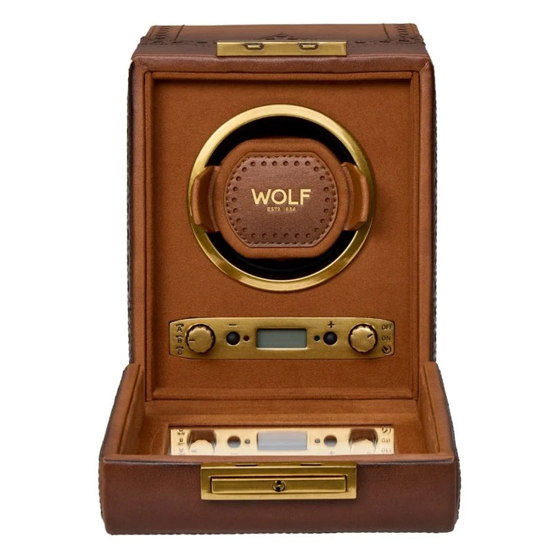 Brown leather watch winder with gold-tone hardware, circular brown leather watch cushion, digital display, and control button