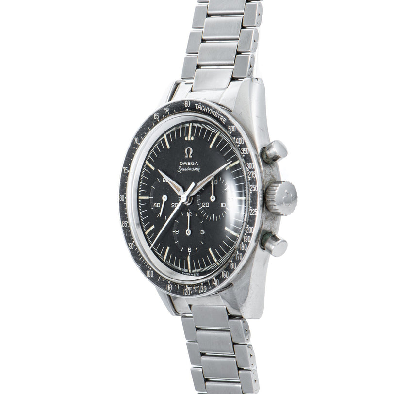 An OMEGA Speedmaster watch featuring a stainless steel case, black dial, and metal bracelet, shown from an angled view.