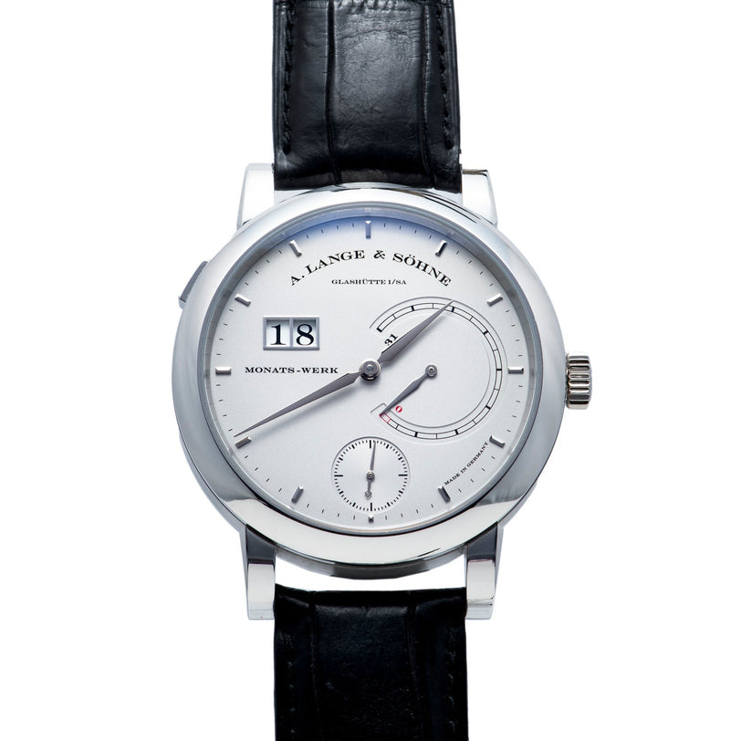 The Lange & Sohne Lange 31 is a luxury wristwatch with a black leather strap, silver dial, and date display.