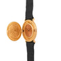 The Piaget 1877 Twenty Dollar Coin Watch features a textured open cover and black leather strap, revealing the elegant watch face.