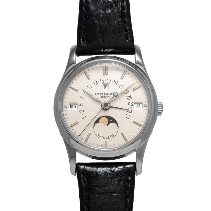 The Patek Philippe Retrograde Perpetual Calendar features a silver case, black leather strap, moonphase, and day-date indicators on the dial.