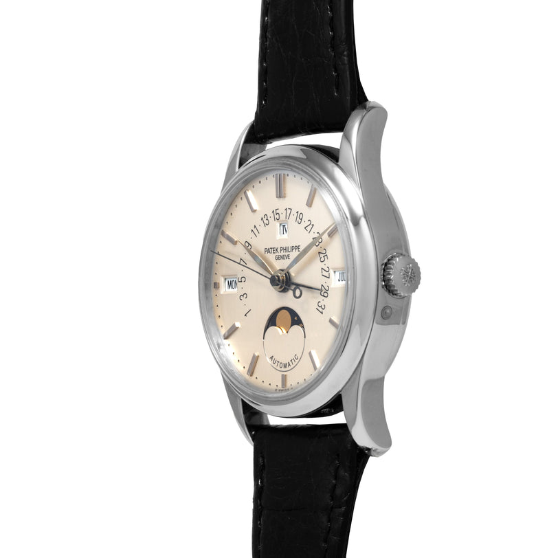 Patek Philippe Retrograde Perpetual Calendar luxury wristwatch featuring a black leather strap, moon phase, date, and day displays on a white background.
