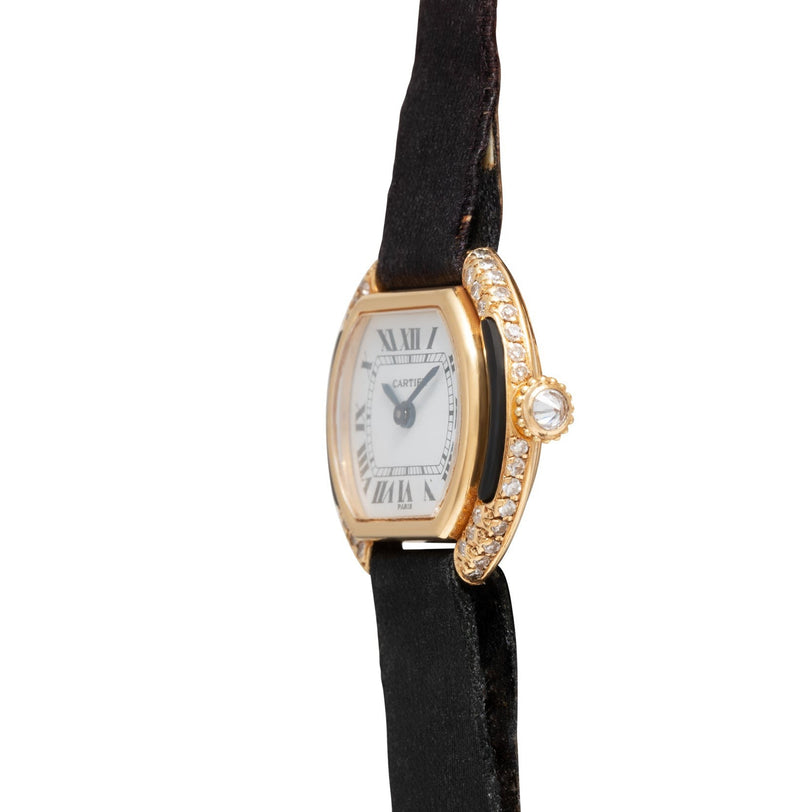 Cartier Ellipse wristwatch featuring diamond accents, black leather strap, and Roman numeral dial, shown from the side.