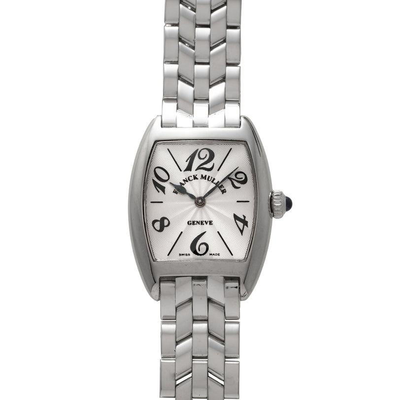 Platinum tonneau watch with silver dial, Arabic numerals, and matching metal bracelet.