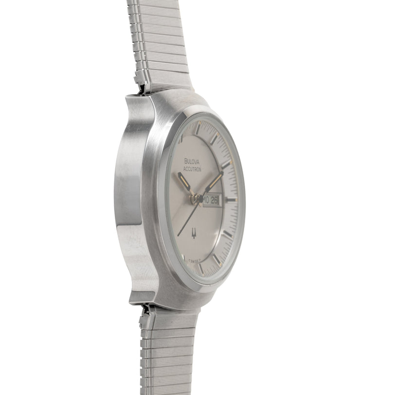 Bulova Accutron ladies watch with silver-tone round case, cream dial, and matching metal bracelet band.