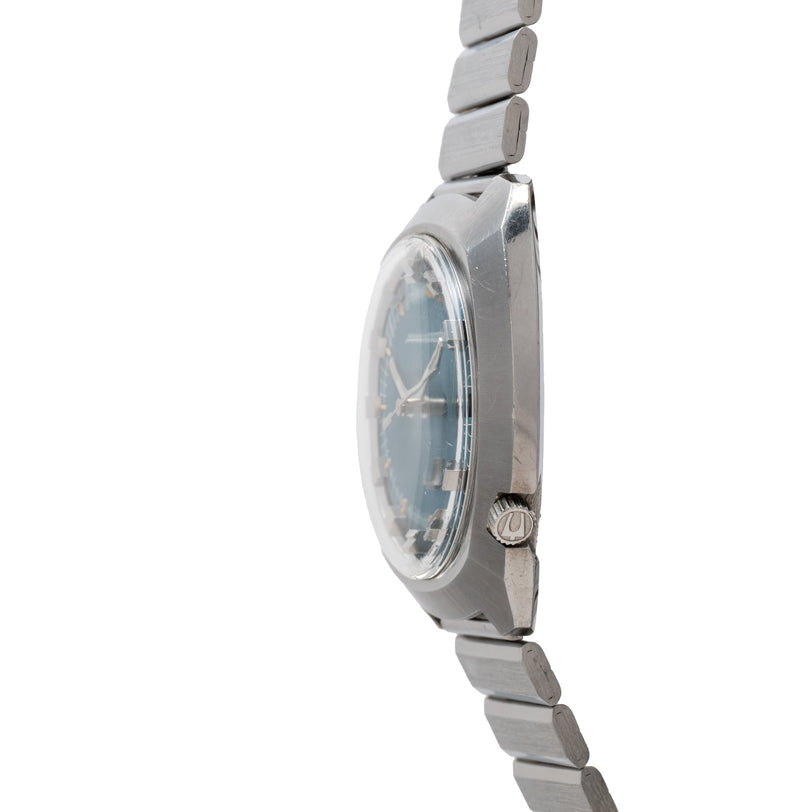 Bulova Accutron 261 watch with cushion-shaped case, blue dial, and stainless steel bracelet, shown from side angle.