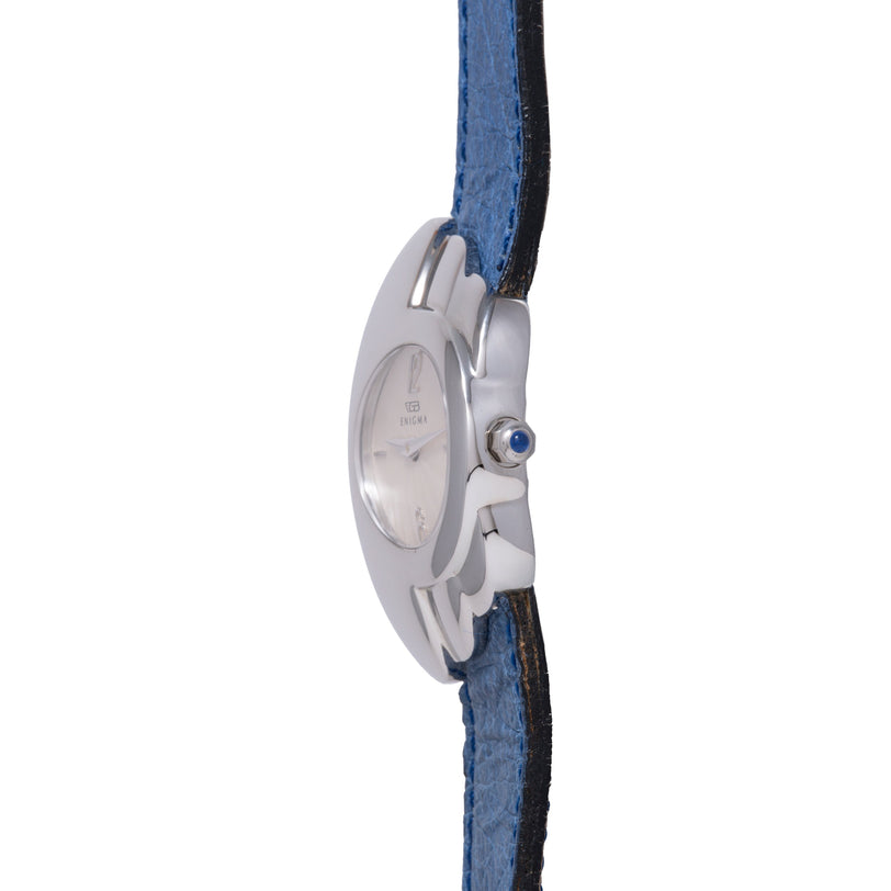 Silver-tone watch with blue and black fabric strap, featuring oval face and blue stone accent on side.